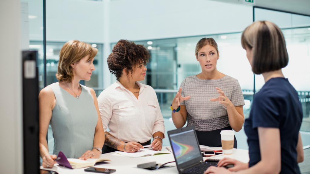 The image aims to visually represent the concept of women thriving in the tech industry, highlighting diversity and inclusion within the workplace.